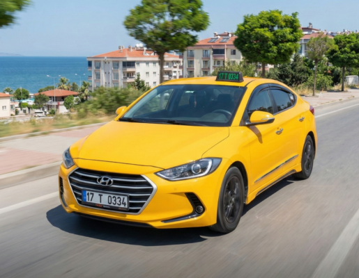 Kepez’de yolda ilerleyen bir taksi